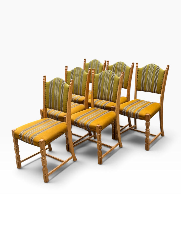 Six Danish oak dining chairs, angled group view