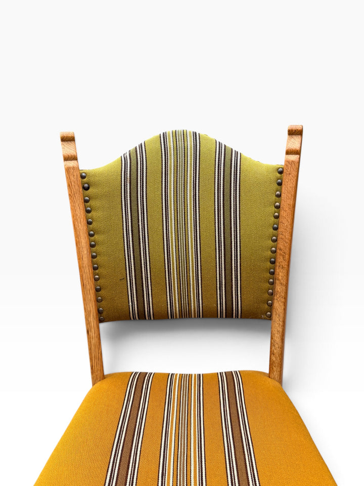 Arched striped backrest with brass nailhead trim