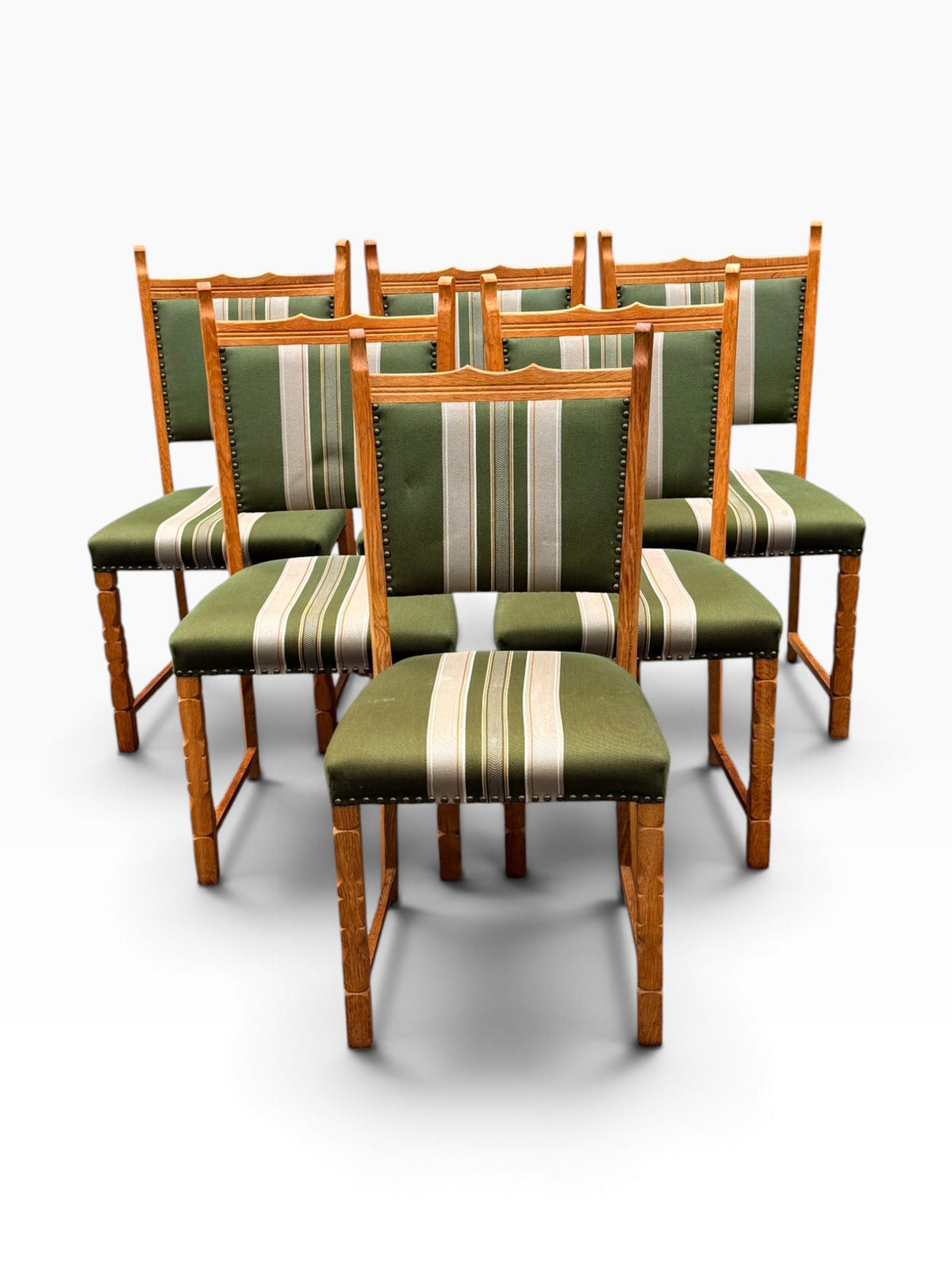 Six Danish oak dining chairs, grouped front view