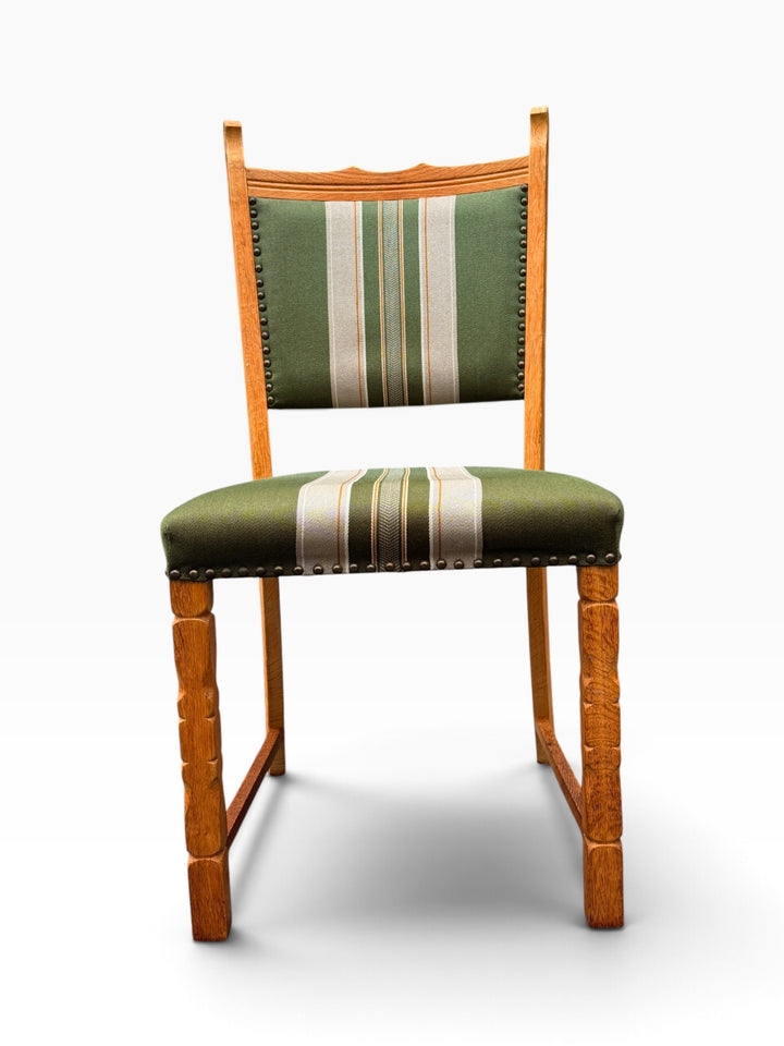 Single oak dining chair, front view with carved legs