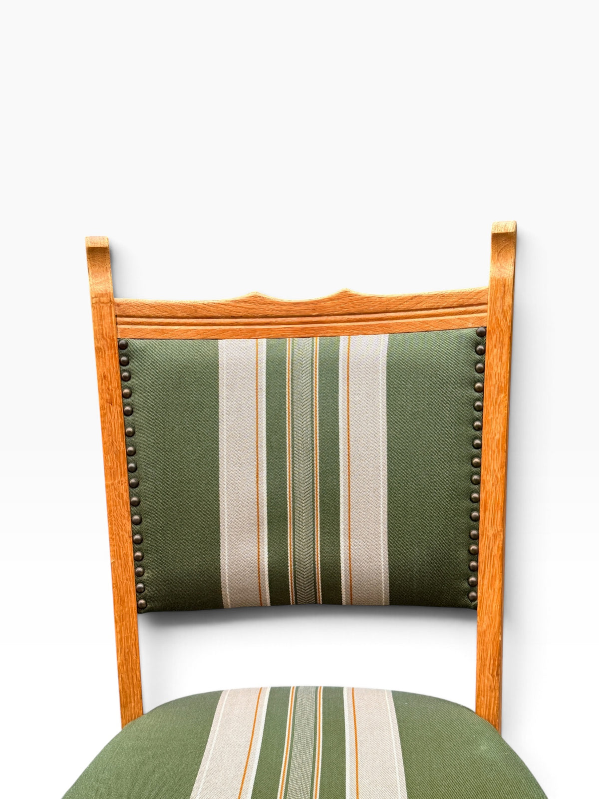 Carved oak crest rail and striped backrest