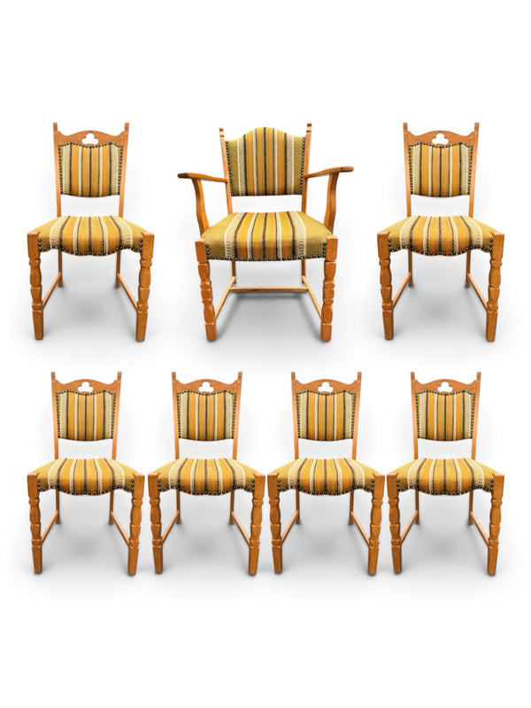 Set of seven Henning Kjærnulf oak dining chairs, captain's chair and six side chairs