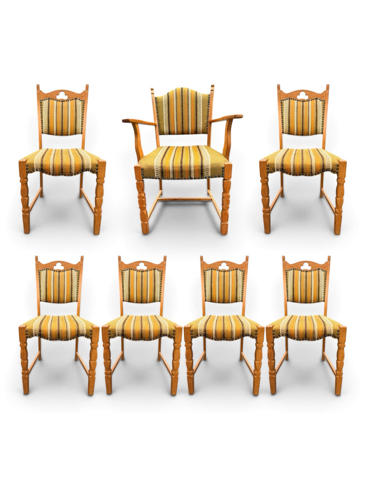Set of seven Henning Kjærnulf oak dining chairs, captain's chair and six side chairs