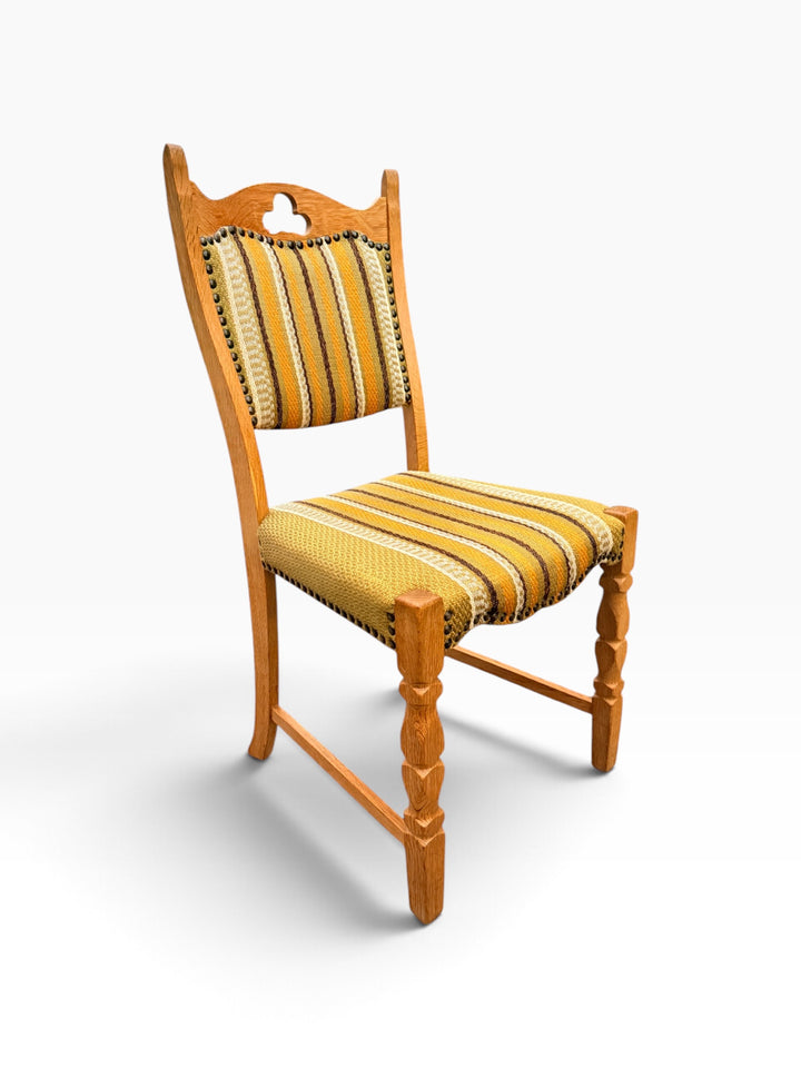 Kjærnulf oak side chair with carved crest rail, angled view