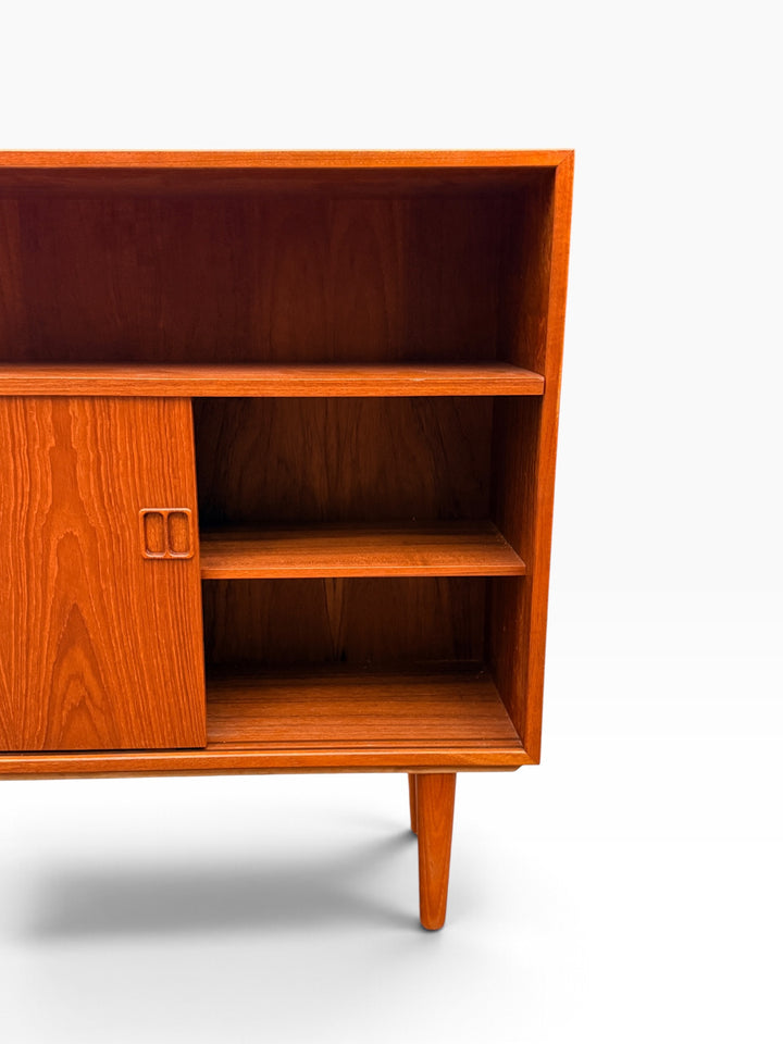Sliding door open showing interior shelf