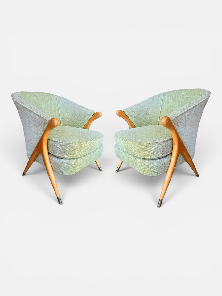 Pair of Italian mid-century lounge chairs in mint green boucle with maple frames — front three-quarter view