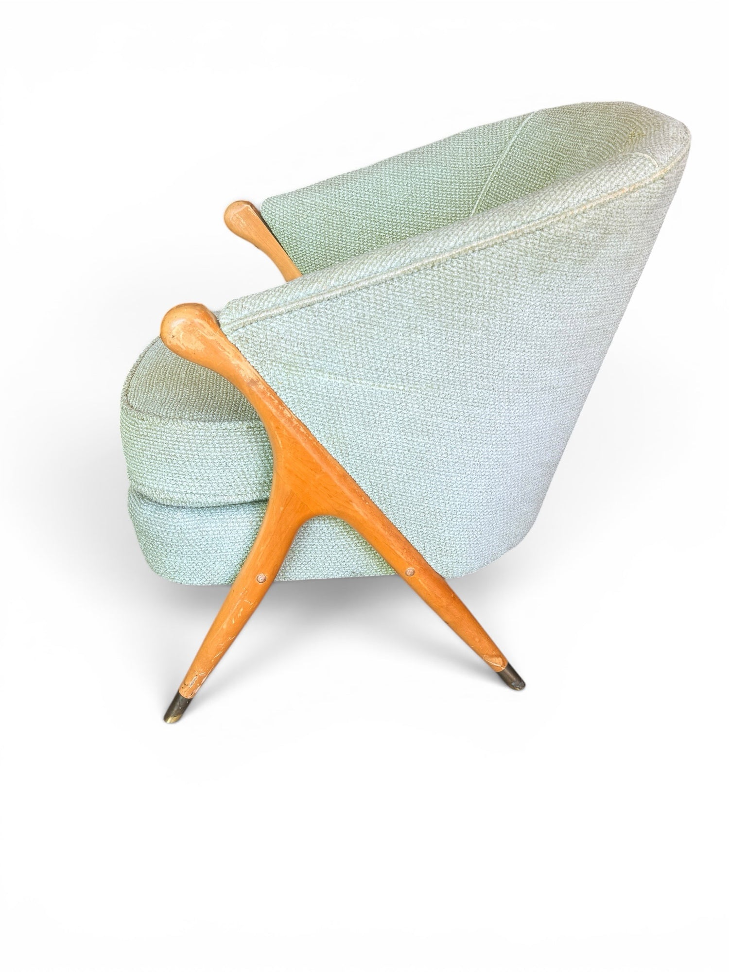 Italian lounge chair — rear three-quarter view showing sculptural frame and leg detail