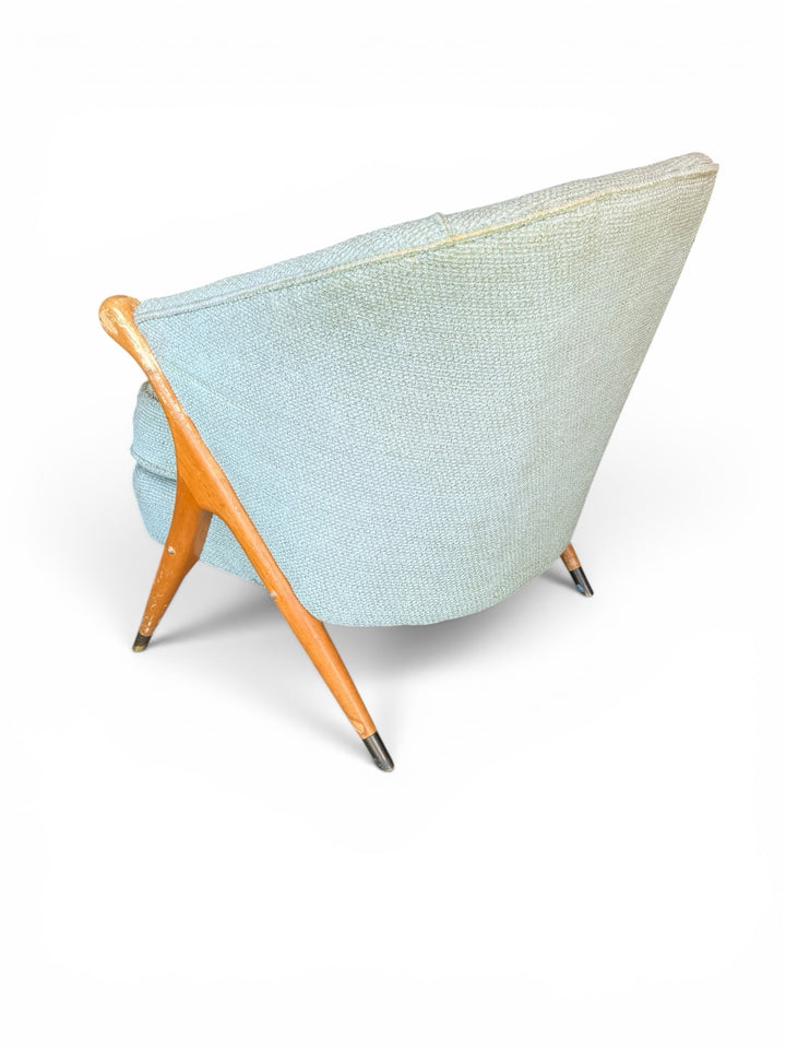 Italian lounge chair — rear view showing barrel back and brass leg tips