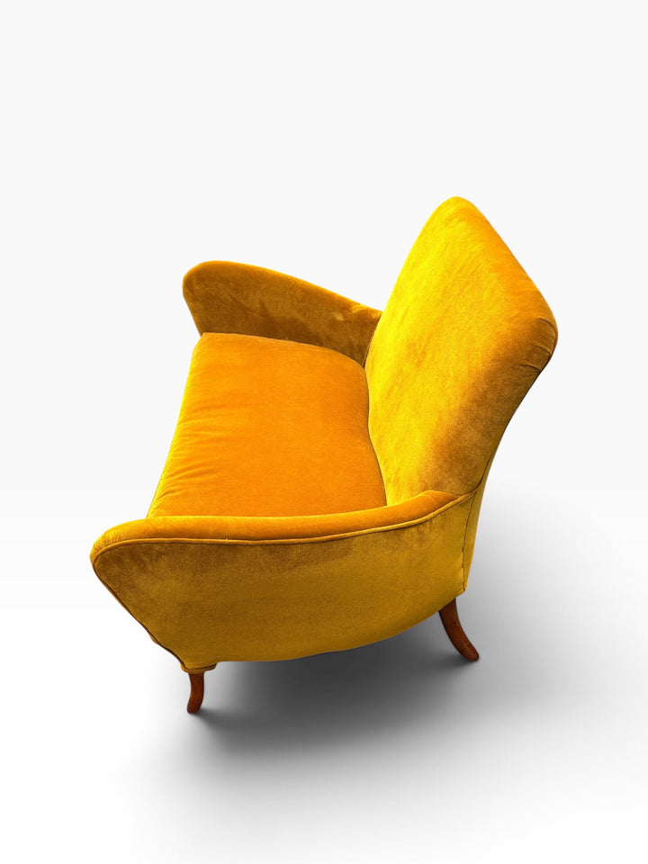 Side profile of the Italian loveseat showing arm sweep and seat depth