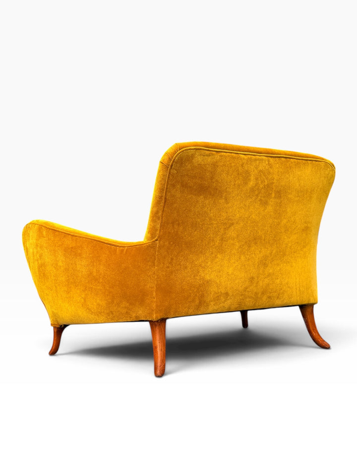 Rear leg and lower back detail of the Italian loveseat