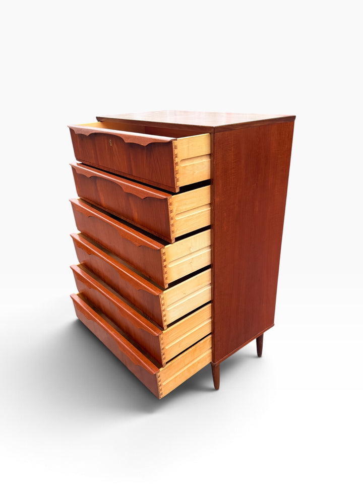 Teak chest with all six drawers open