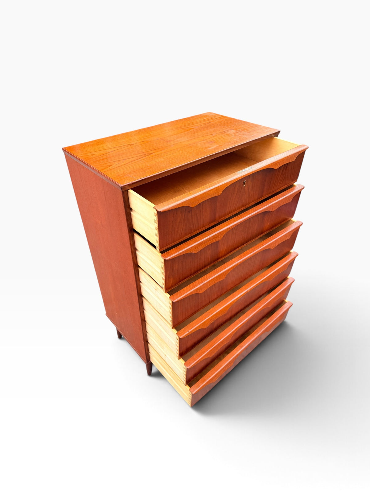 Teak chest with drawers open, angled view