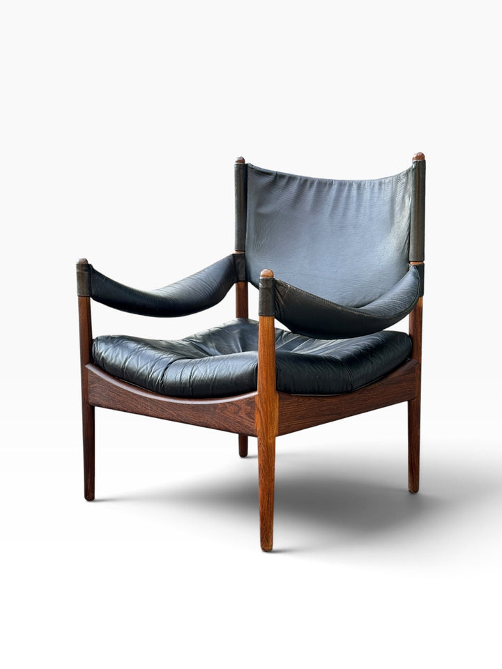 Modus lounge chair with leather sling arms, three-quarter view