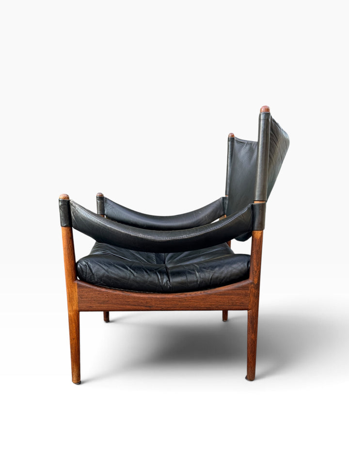 Modus chair side angle showing rosewood frame