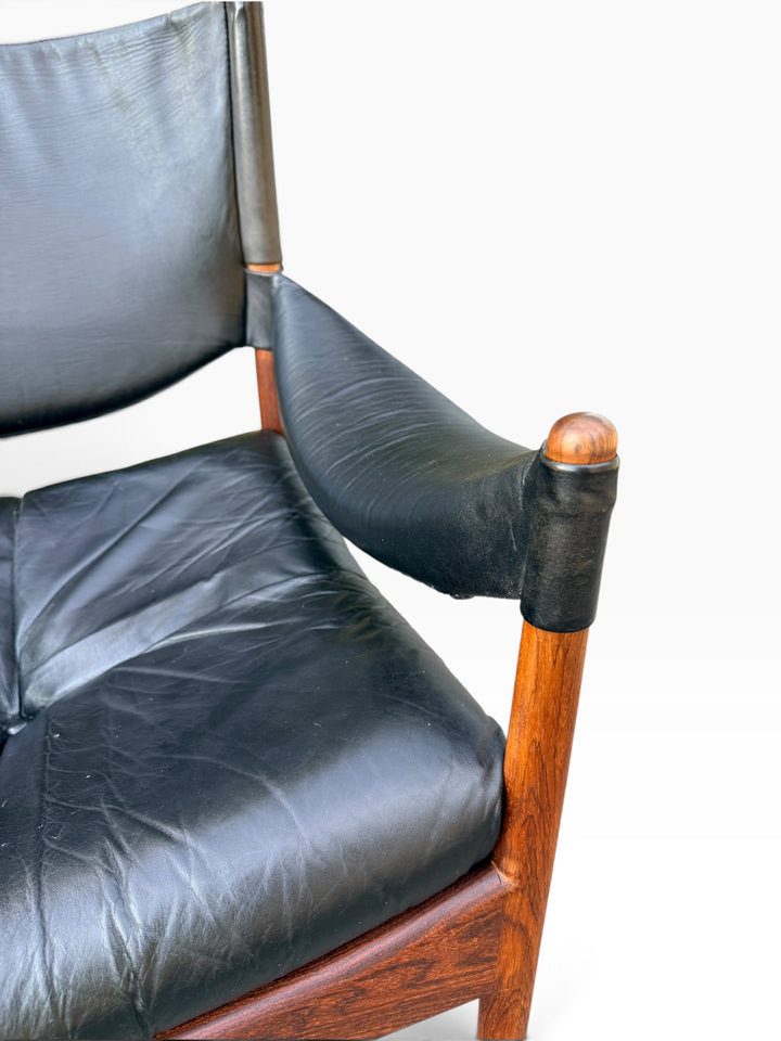 Detail of leather seat cushion and arm post