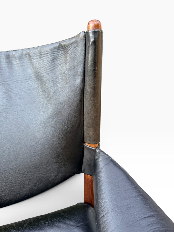 Close-up of leather back sling and rosewood post