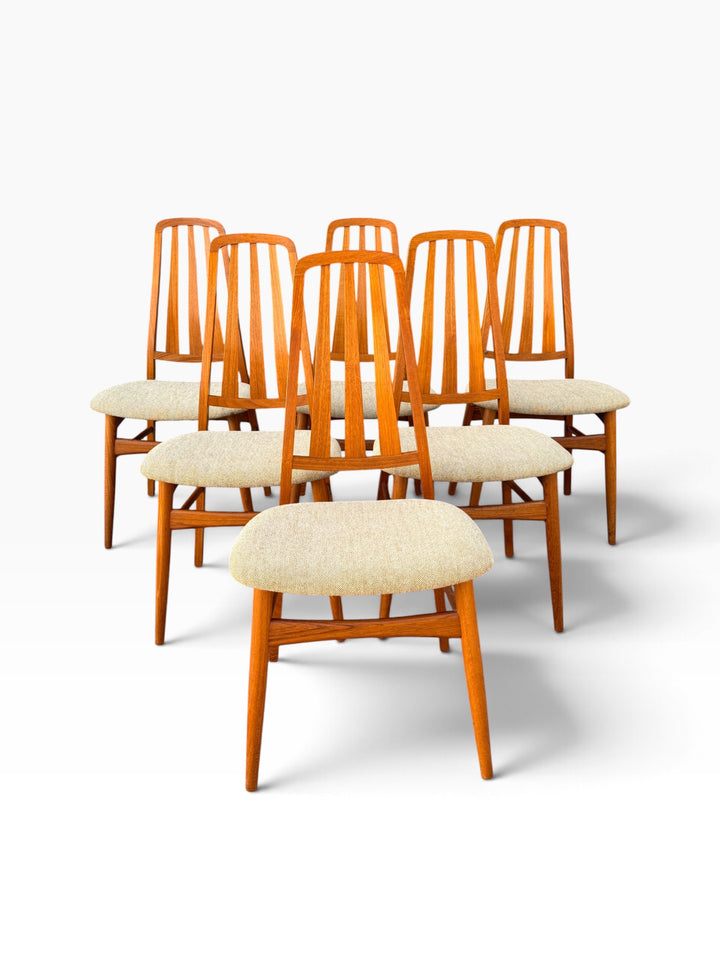 Six Danish modern teak dining chairs grouped together