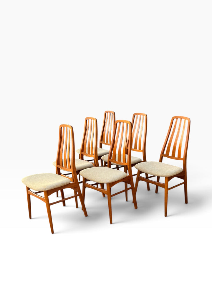 Set of six teak dining chairs, angled view
