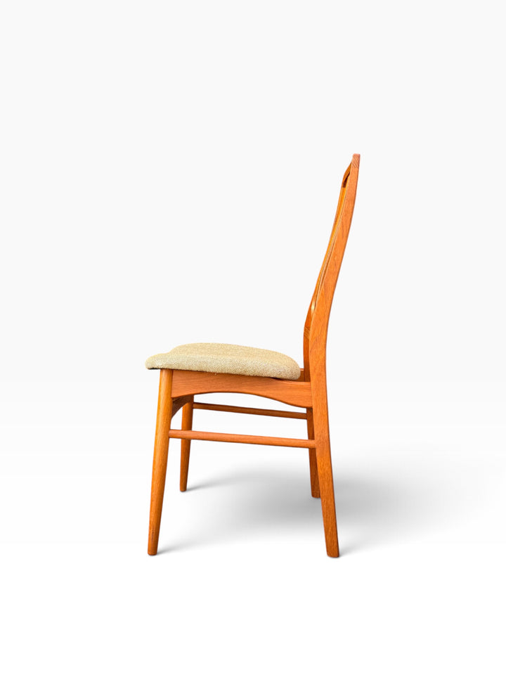 Teak dining chair side profile showing tall slatted back