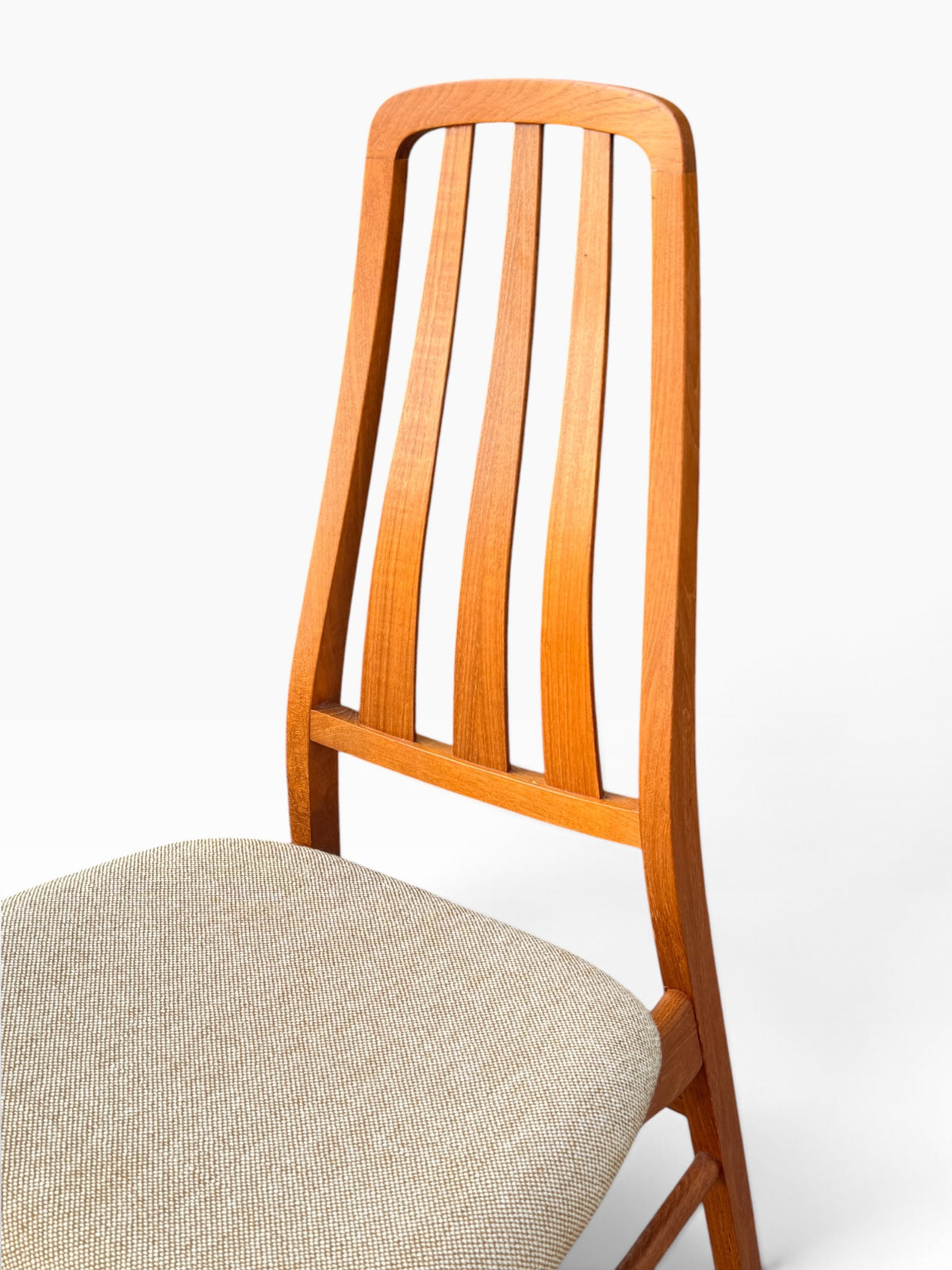 Detail of teak slat back and oatmeal wool seat