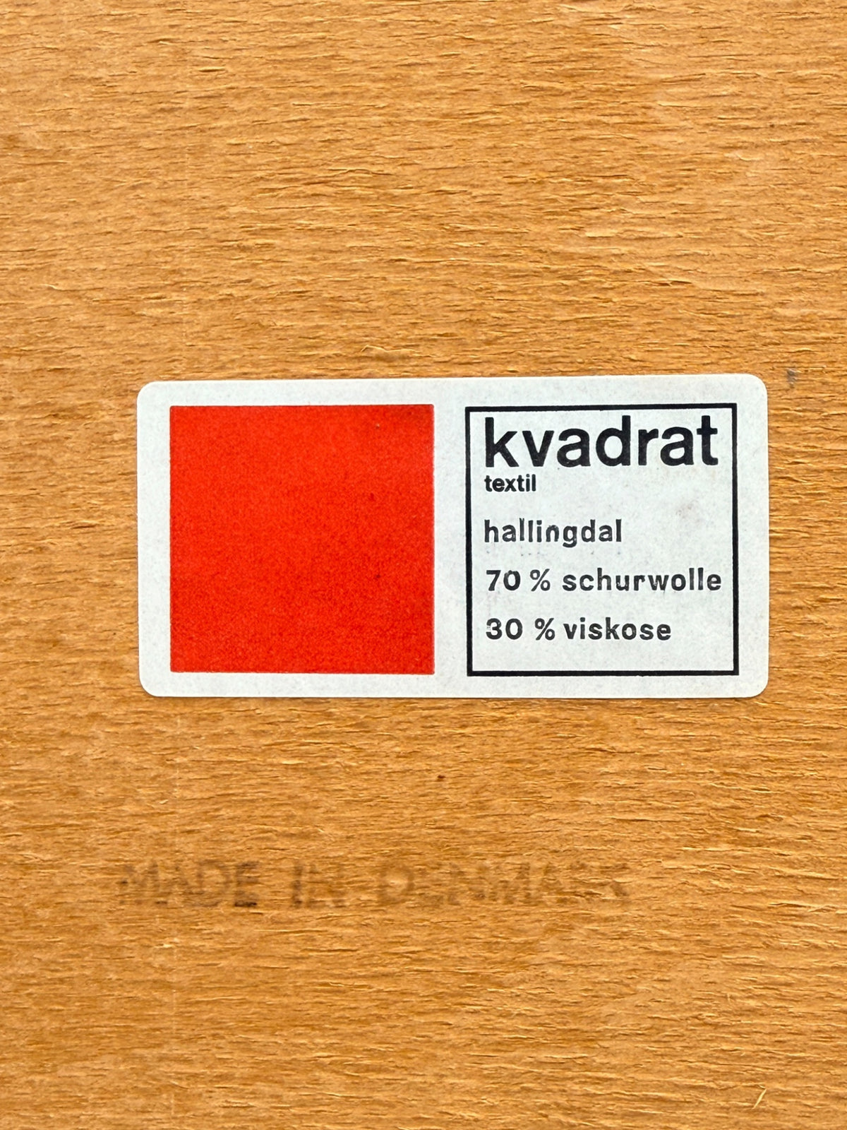 Kvadrat Hallingdal fabric label and Made in Denmark stamp under the seat