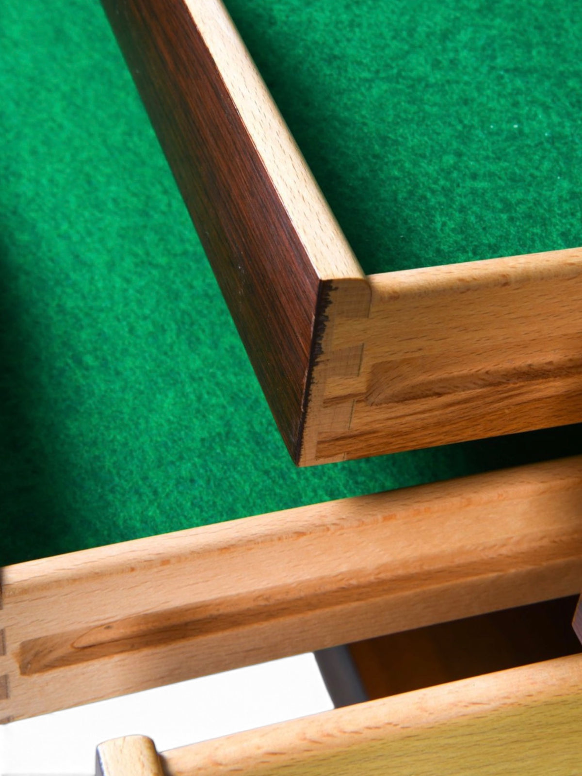 Green felt-lined drawer with dovetail joinery