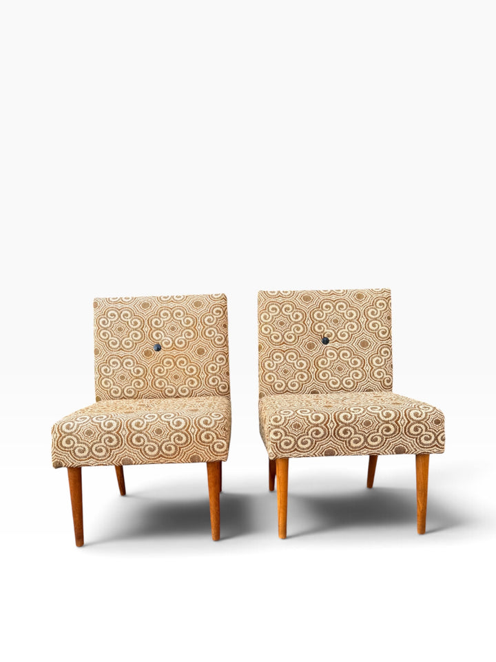 Pair of Hungarian mid-century slipper chairs in original swirl pattern fabric, front view