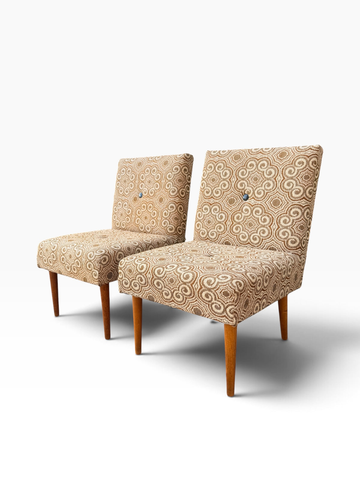 Pair of vintage slipper chairs, angled view