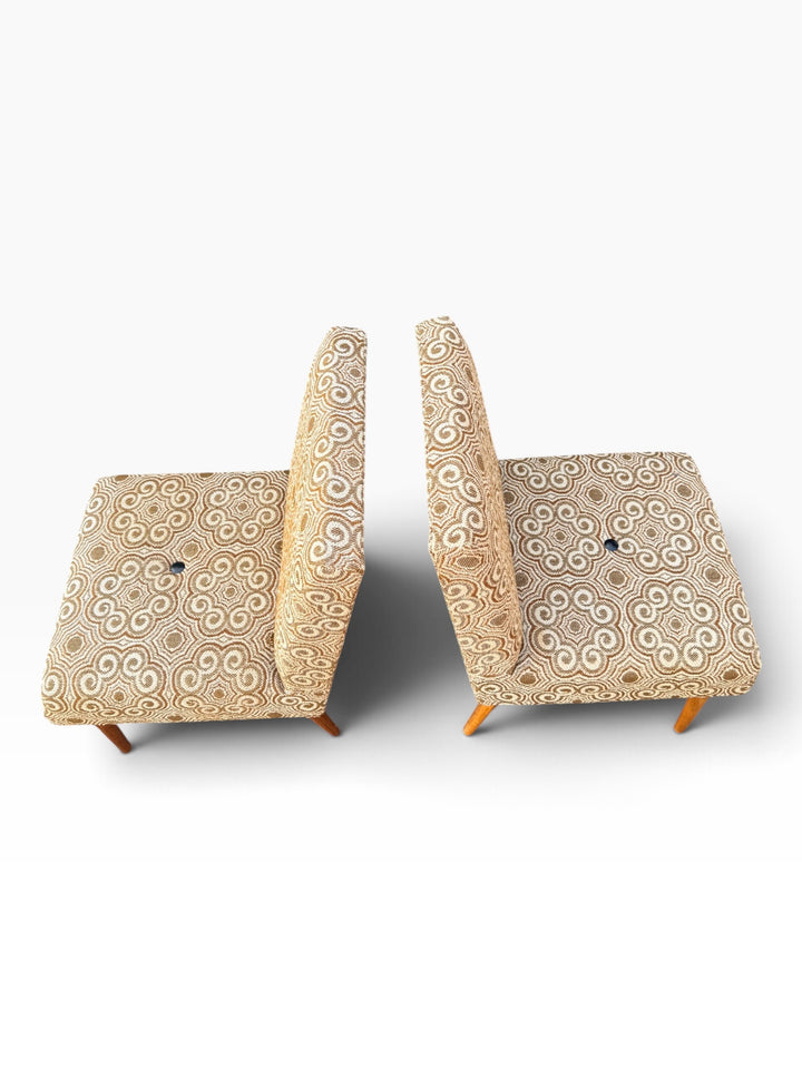 Slipper chairs showing button-tufted seats
