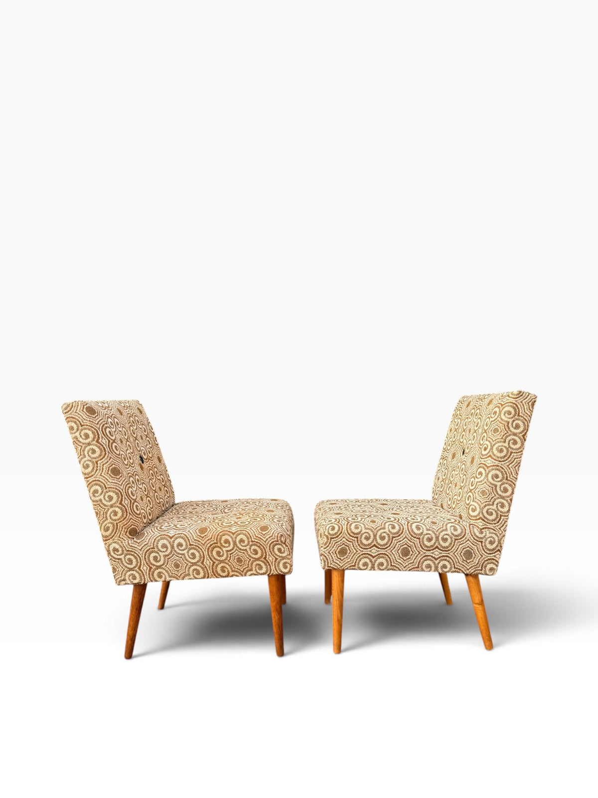 Pair of slipper chairs, rear three-quarter view
