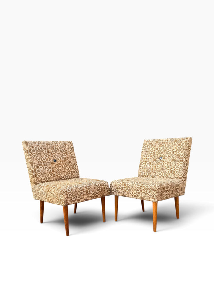 Pair of slipper chairs angled toward each other