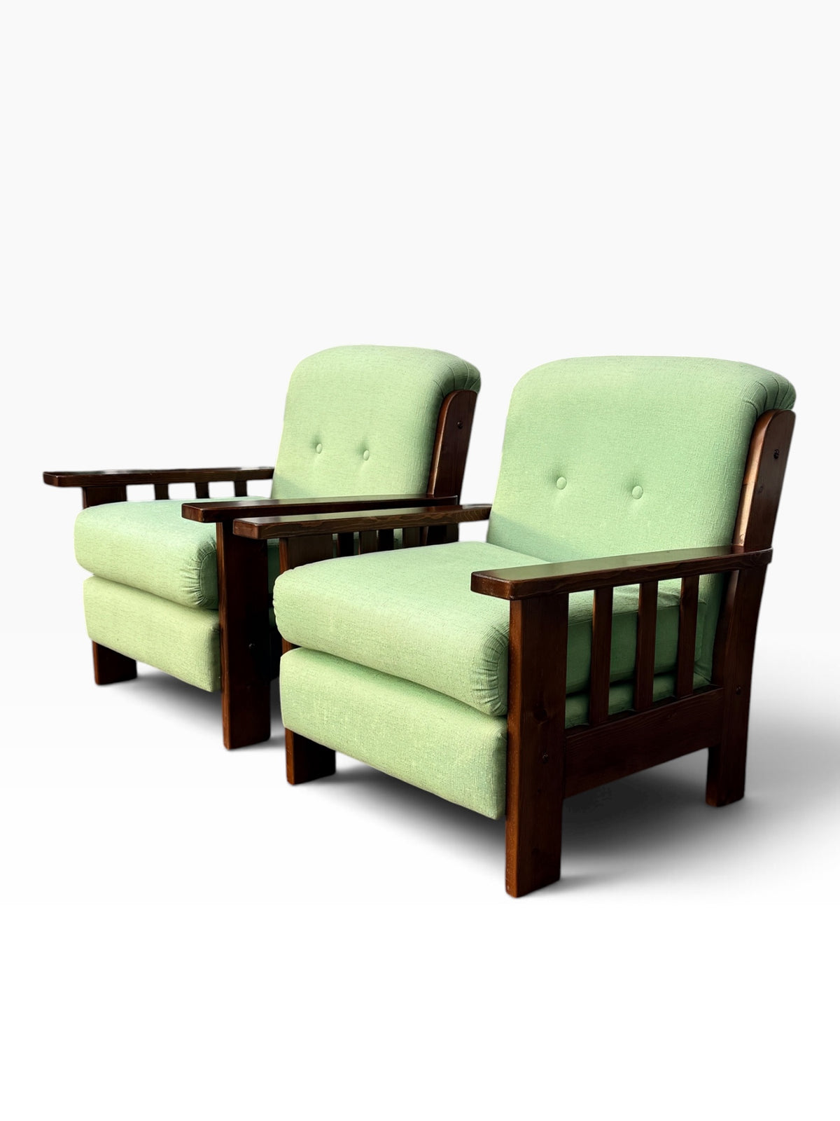 Pair of Mission oak lounge chairs, angled view