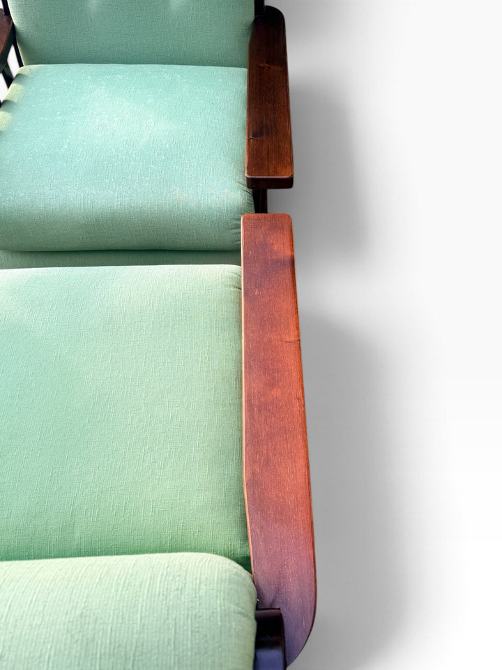 Flat oak armrest and mint green seat cushion detail