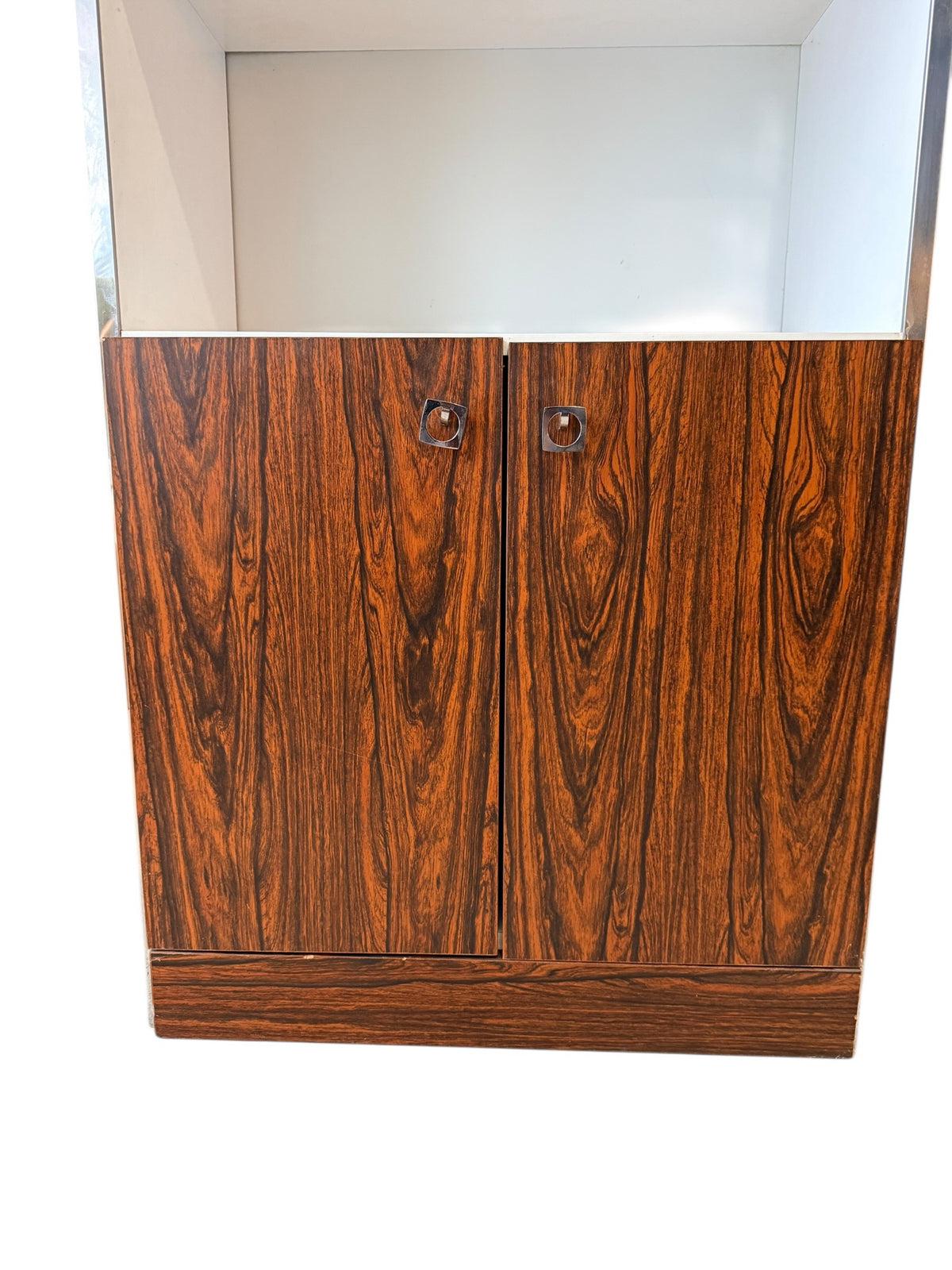 Two-door rosewood-grain lower cabinet with chrome pulls