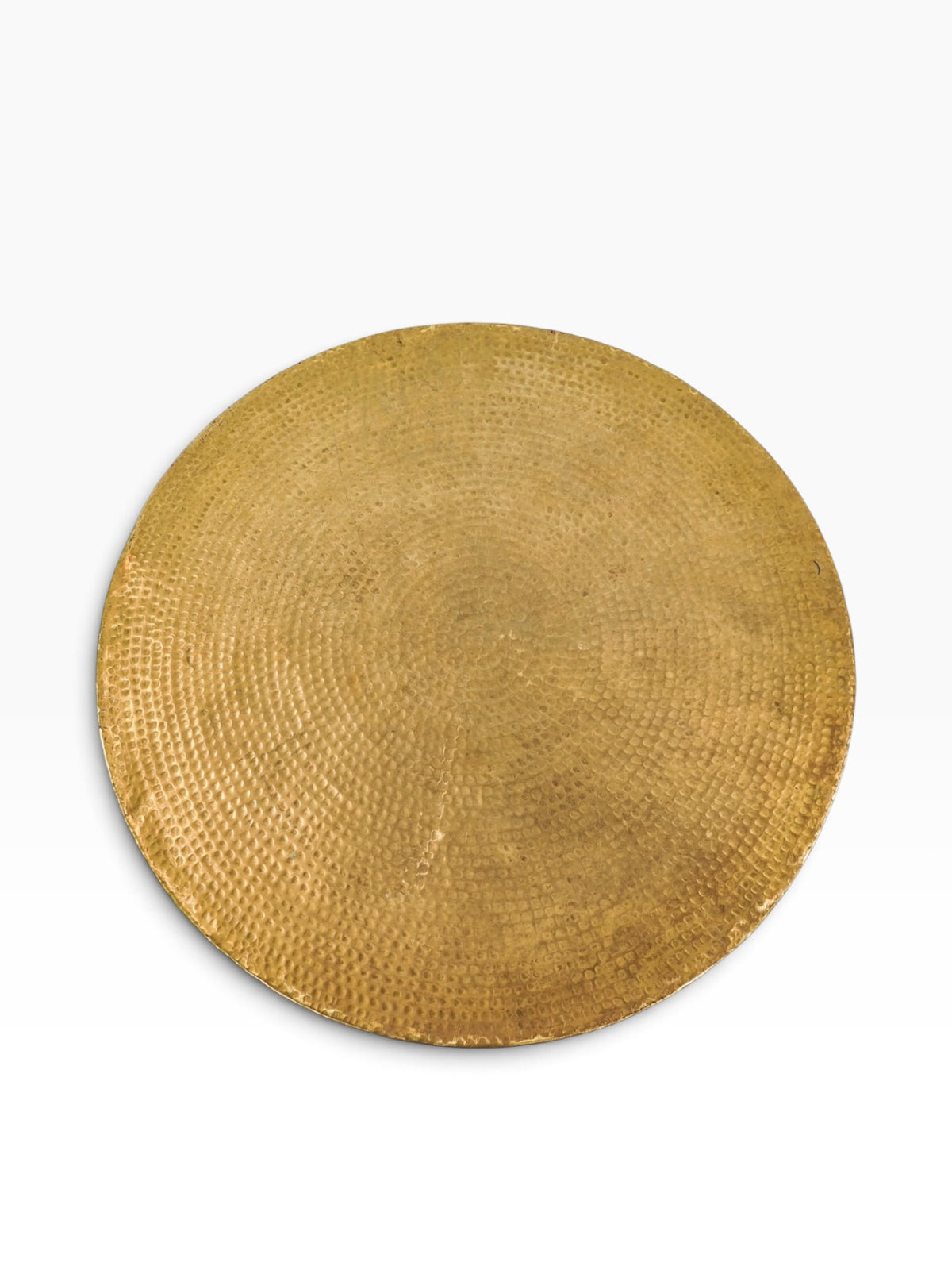 Hammered brass top of the Studio A Izmir round coffee table seen from above