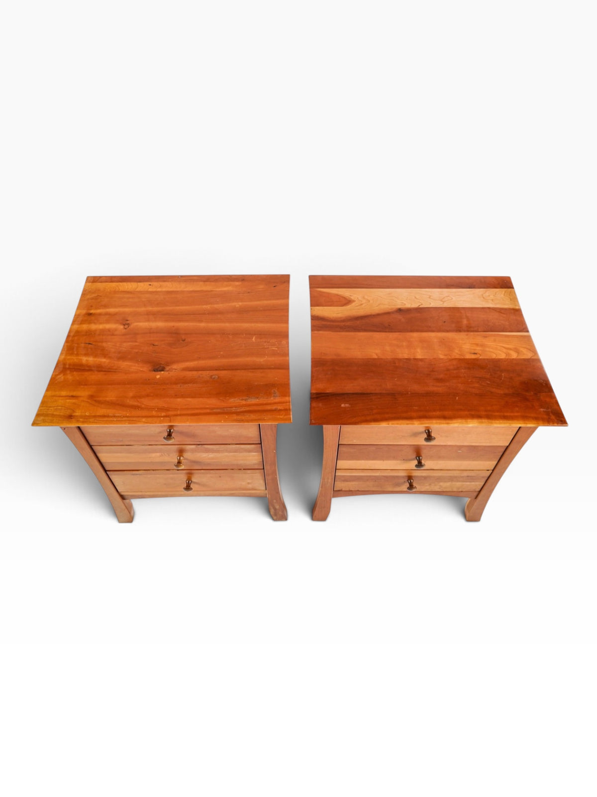 Overhead view of the two solid cherry nightstand tops showing grain and light surface wear