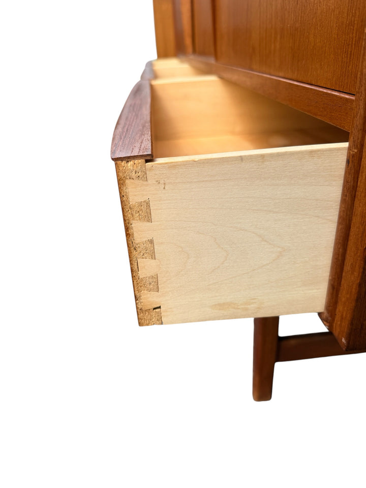 E.W. Bach teak highboard — tapered legs and stretcher base detail