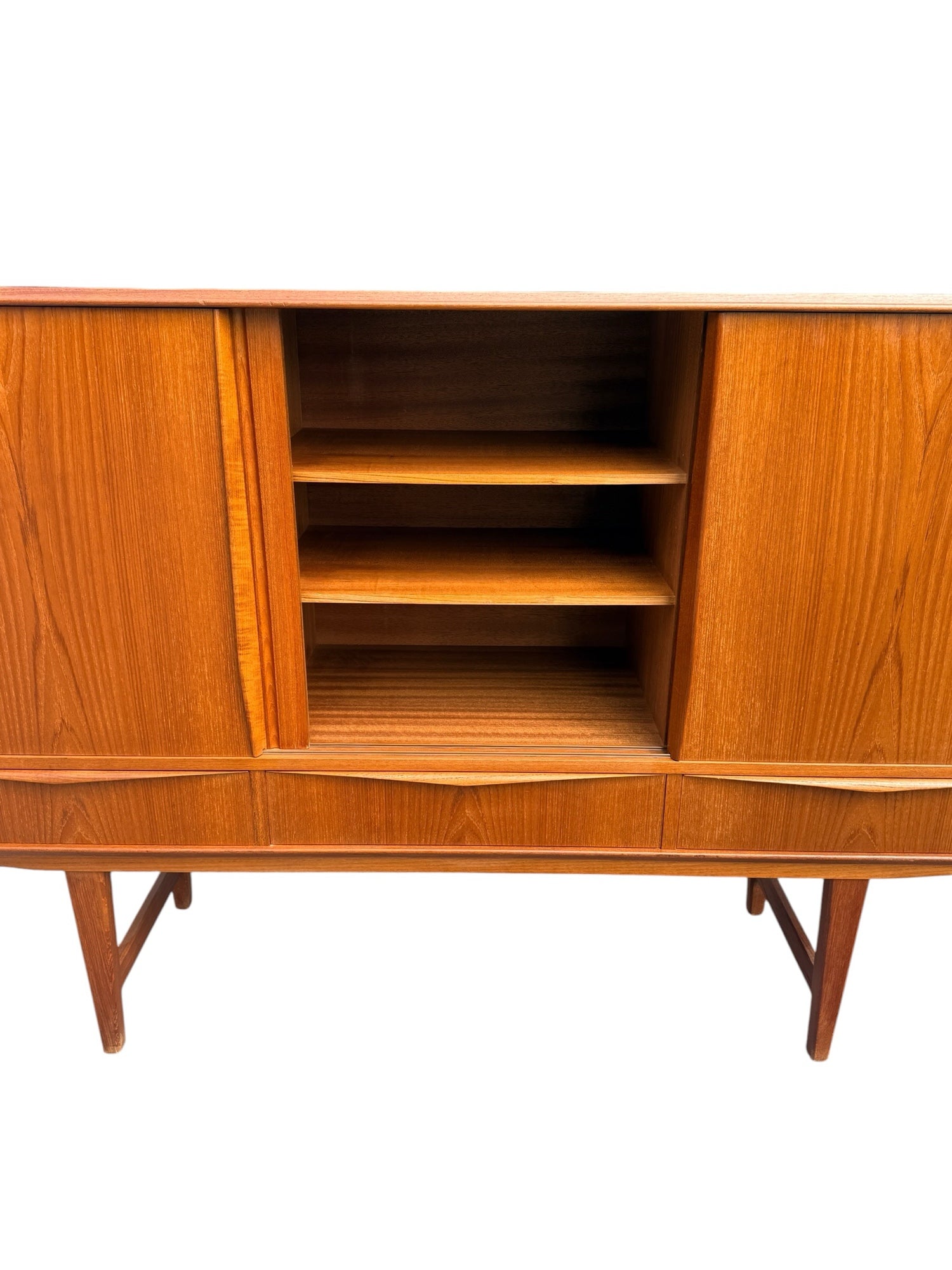 E.W. Bach teak highboard — sculpted bow-tie drawer pulls detail