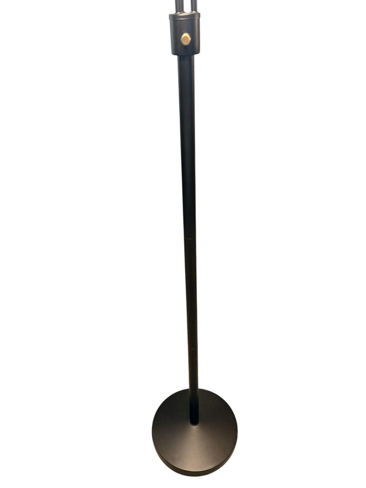 Modern three-arm floor lamp — stem and round base detail